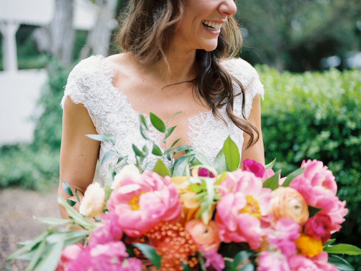 woman wedding dress holding flowers