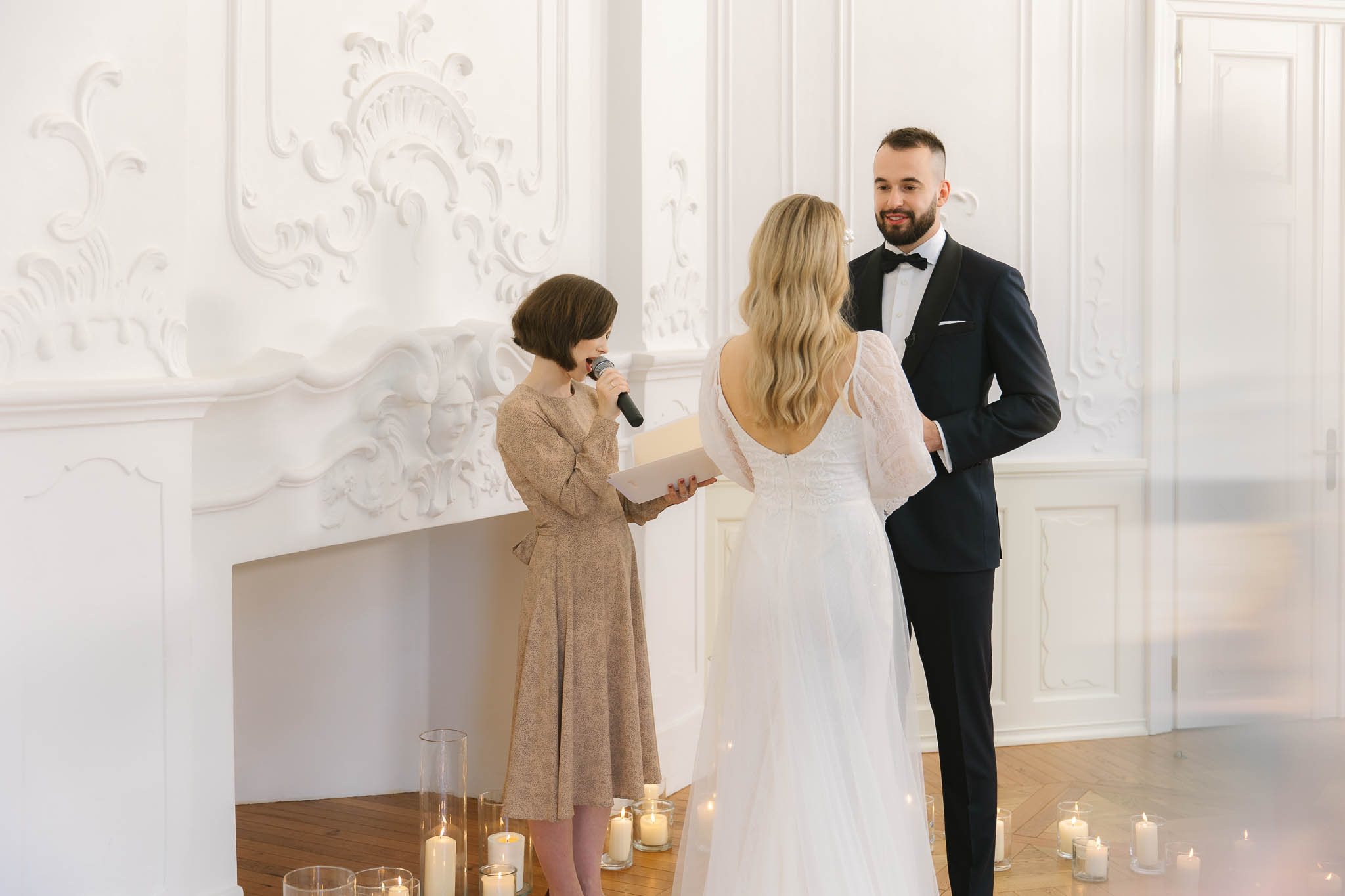 A couple getting married by an officiant