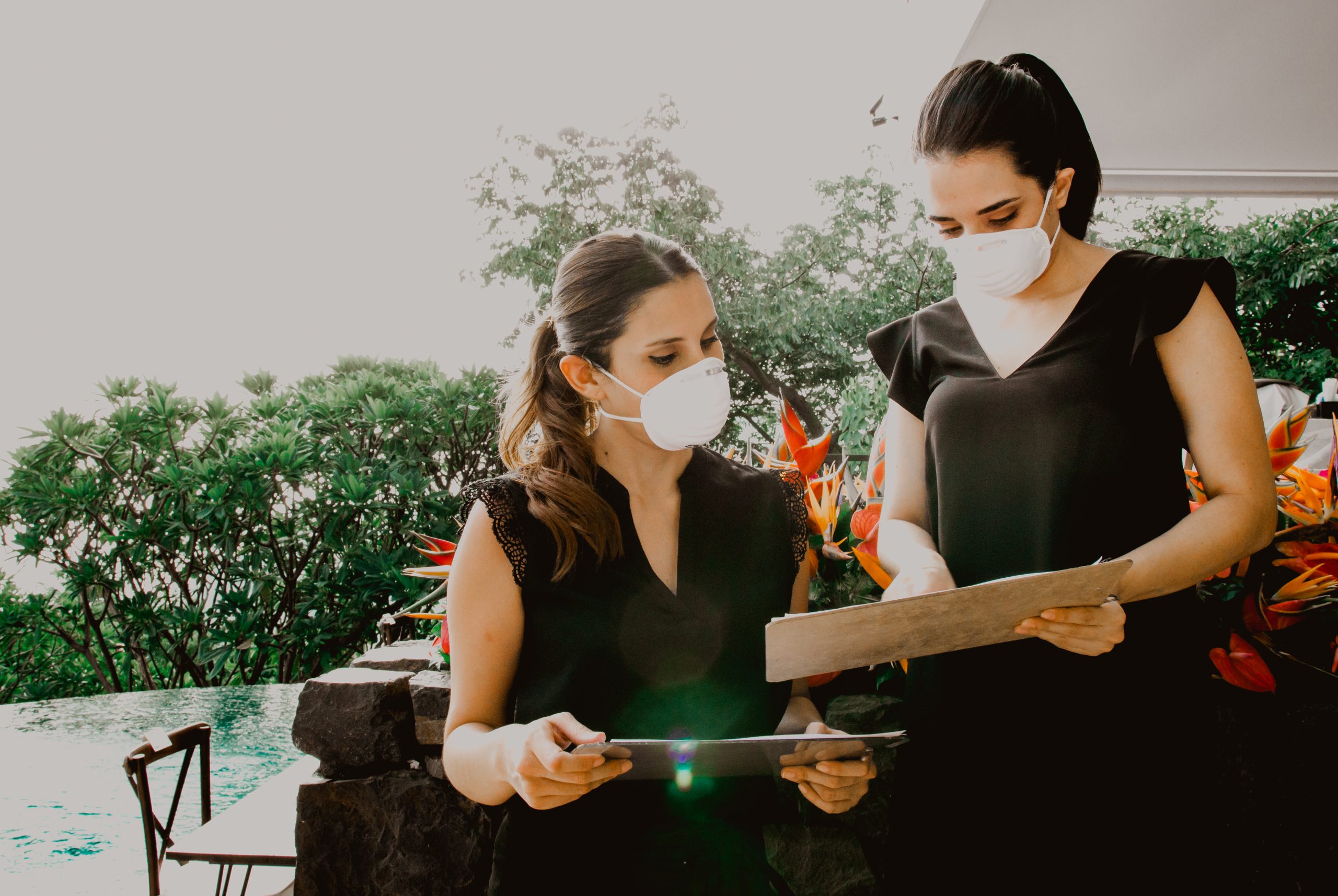 Two event pros wearing masks 
