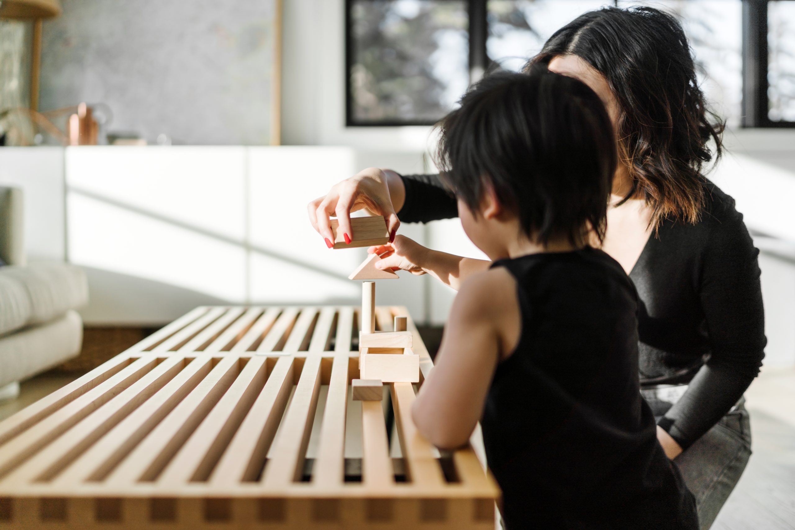 Parent and child playing with blocks