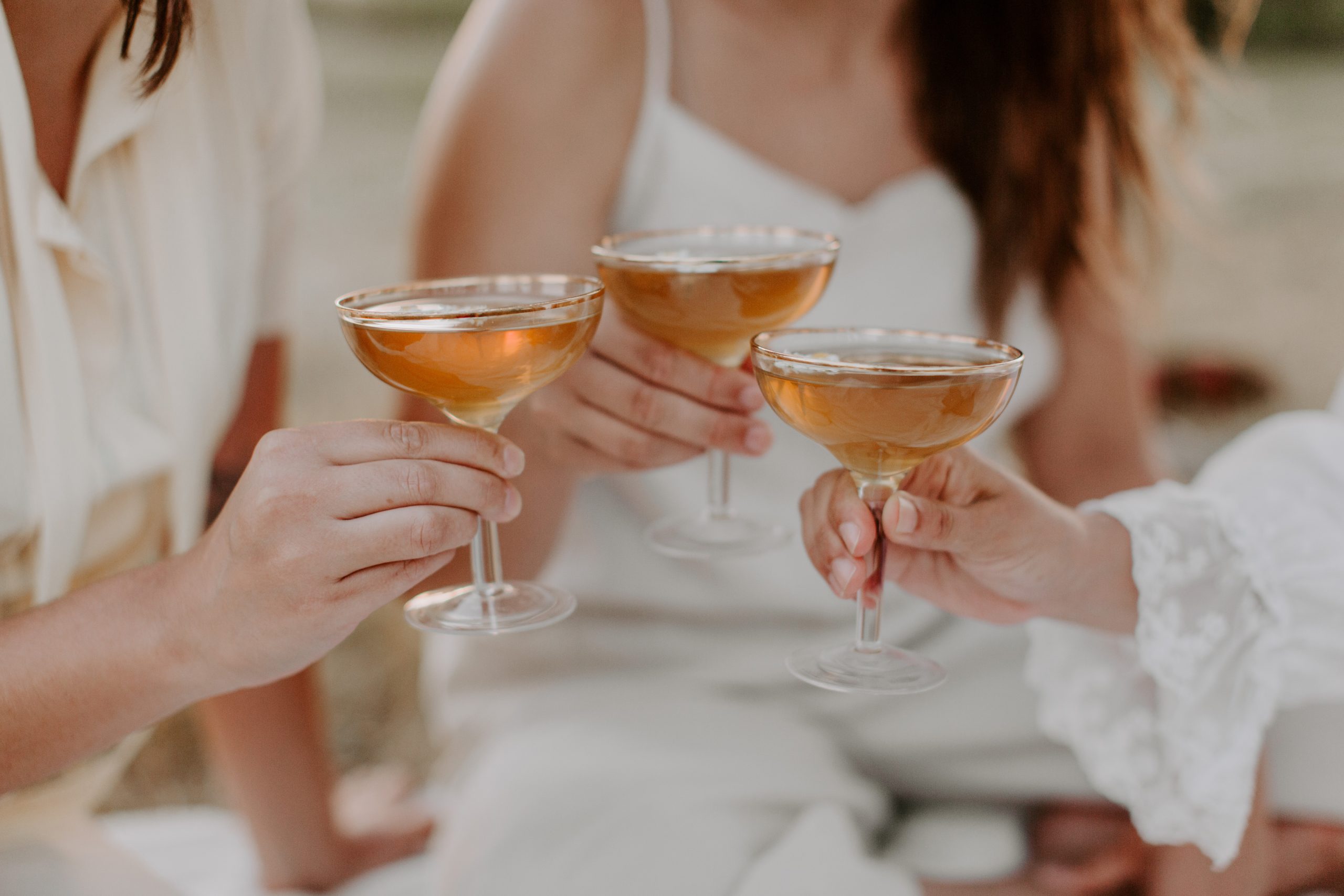 A group doing cheers with drinks